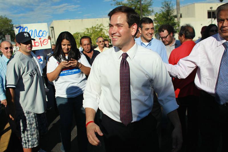 Marco Rubio is surrounded by supporters as he makes a campaign appearance outside an early voting location on October 20, 2010 in Miami, Florida.